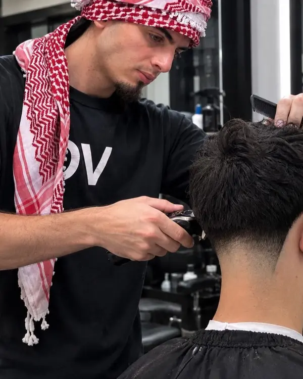 Mohammad giving a client a fade
