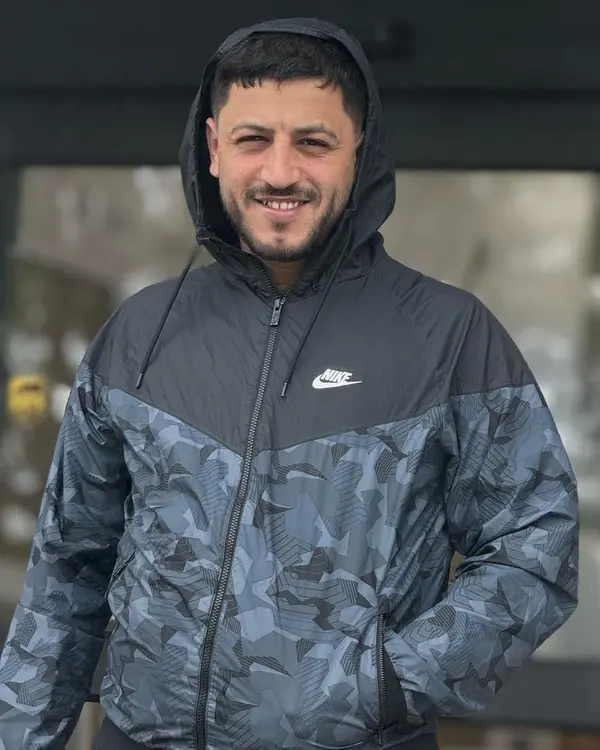Yazan outside the shop